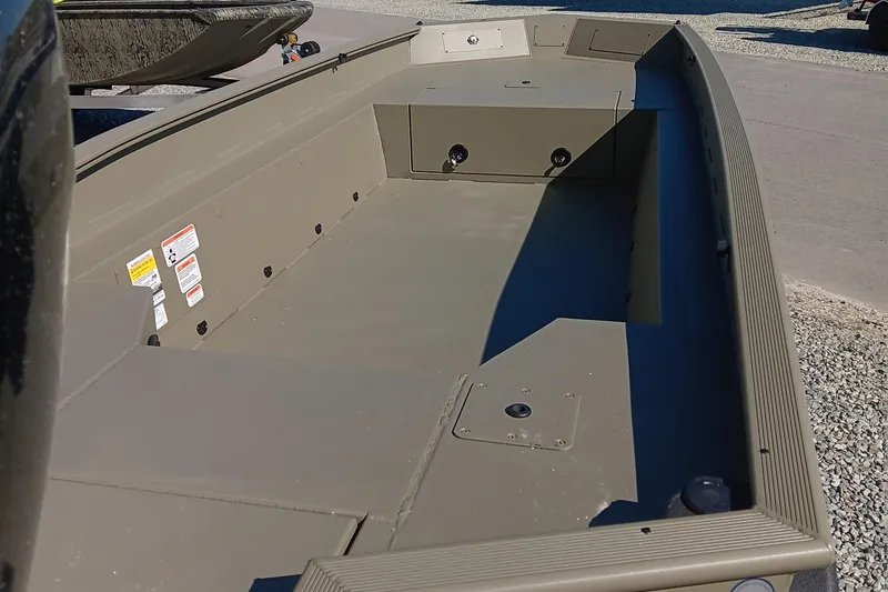 Slide: The Image of 2026 Tracker Grizzly 1650 T Prairie Wings Edition boat on trailer, side view. - 6