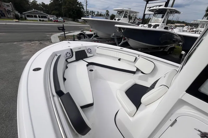Slide: The Image of 2026 Tidewater 210 LXF boat interior with white seating and modern design. - 12
