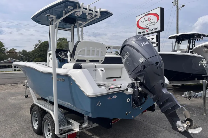 Slide: The Image of 2026 Tidewater 210 LXF boat with Yamaha 150 engine on trailer at Marker 17 Marine. - 2