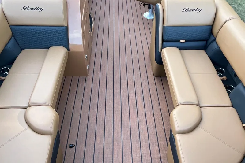 Slide: The Image of 2025 Bentley Pontoons 220/223 Elite Admiral interior with tan and blue seating. - 13