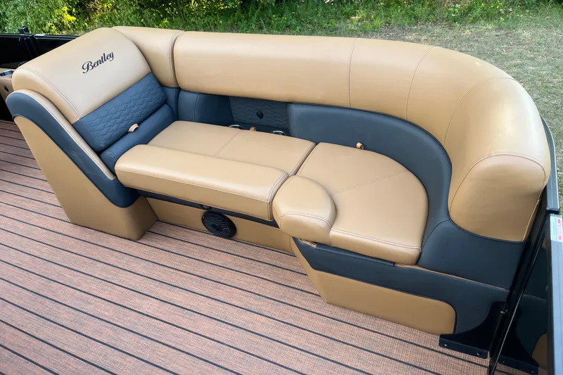 Slide: The Image of Luxurious seating on 2025 Bentley Pontoons 220/223 Elite Admiral boat, featuring tan and gray upholstery. - 15