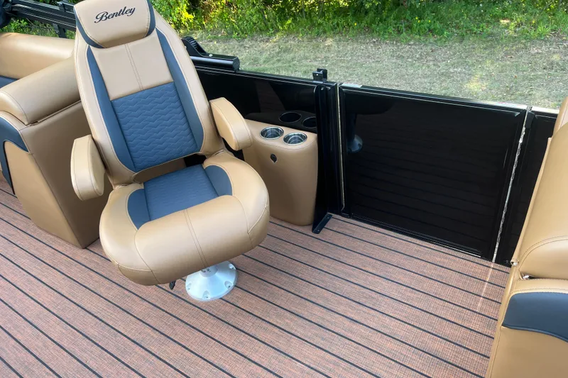 Slide: The Image of 2025 Bentley Pontoons 220/223 Elite Admiral interior with luxurious seating and cup holders. - 16