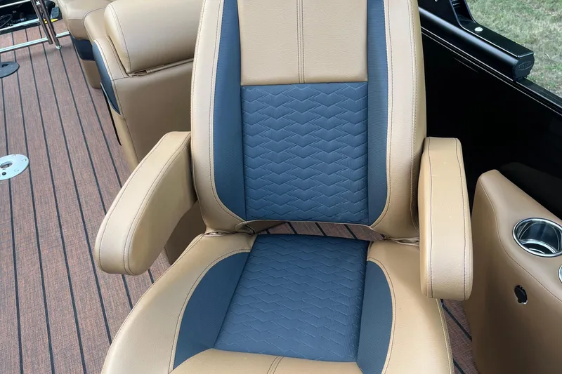 Slide: The Image of Luxurious seating on 2025 Bentley Pontoons 220/223 Elite Admiral with tan and blue upholstery. - 17