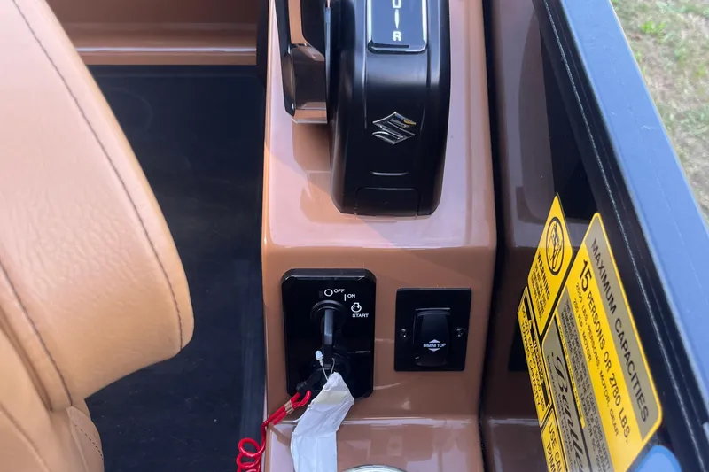 Slide: The Image of Control panel of 2025 Bentley Pontoons 220/223 Elite Admiral with ignition and capacity labels. - 22