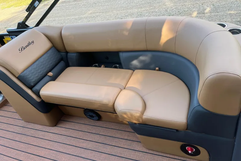 Slide: The Image of Luxurious seating on 2025 Bentley Pontoons 220/223 Elite Admiral boat, featuring tan and gray upholstery. - 25