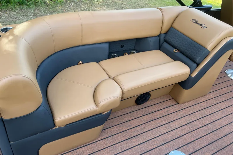 Slide: The Image of Luxurious seating on 2025 Bentley Pontoons 220/223 Elite Admiral boat, featuring tan and black upholstery. - 27