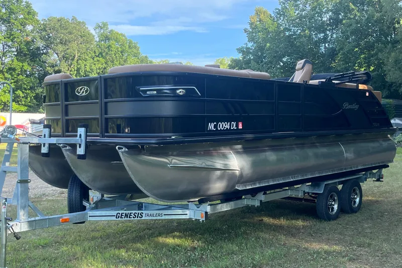 Slide: The Image of 2025 Bentley Pontoons 220/223 Elite Admiral on trailer, parked outdoors. - 4