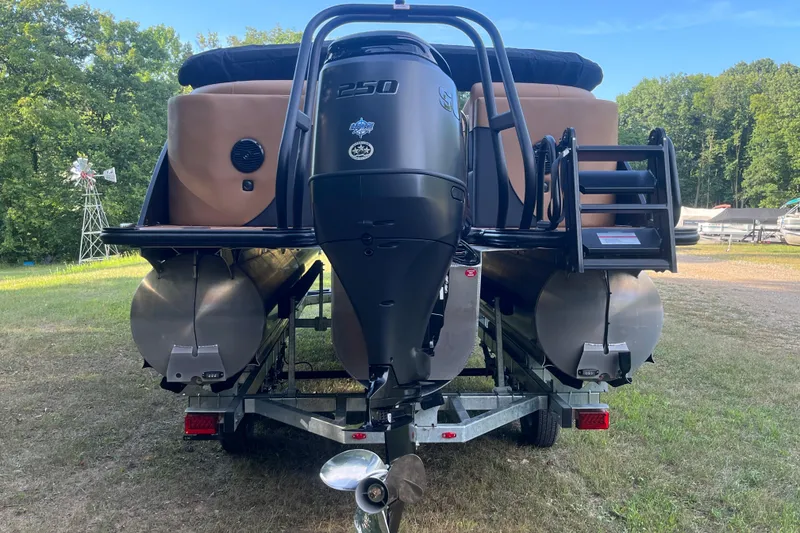 Slide: The Image of 2025 Bentley Pontoons 220/223 Elite Admiral on trailer, rear view with outboard motor. - 7