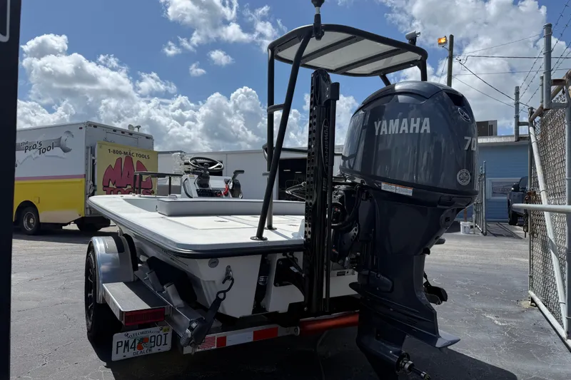 Slide: The Image of 2026 Maverick 17HPX-S boat with Yamaha 70 engine on trailer, parked outdoors. - 10