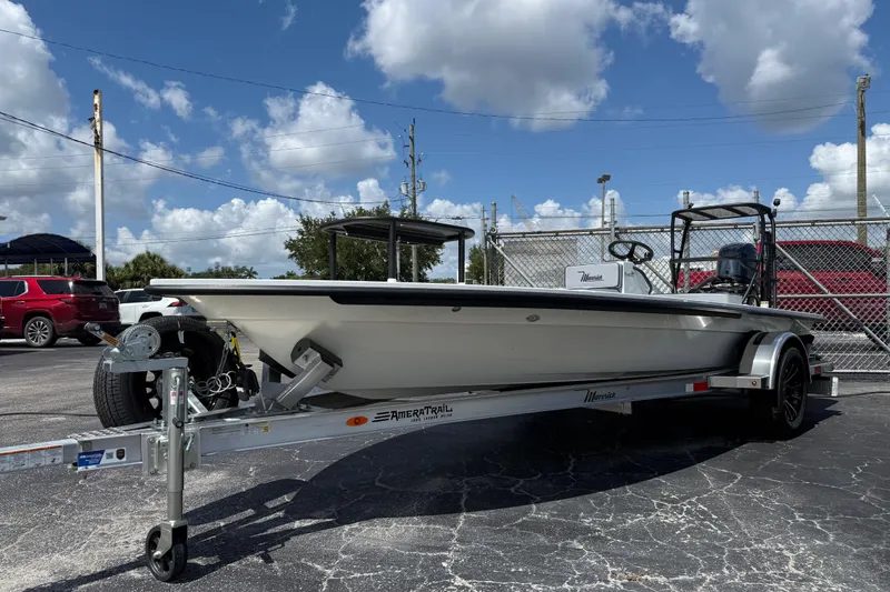 Slide: The Image of 2026 Maverick 17HPX-S boat on trailer under a cloudy sky. - 13