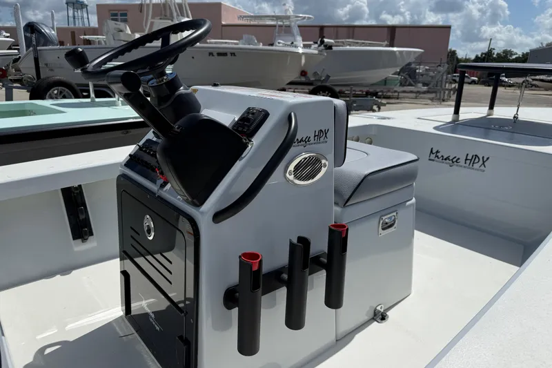 Slide: The Image of 2026 Maverick 17HPX-S boat interior with steering console and seating. - 6