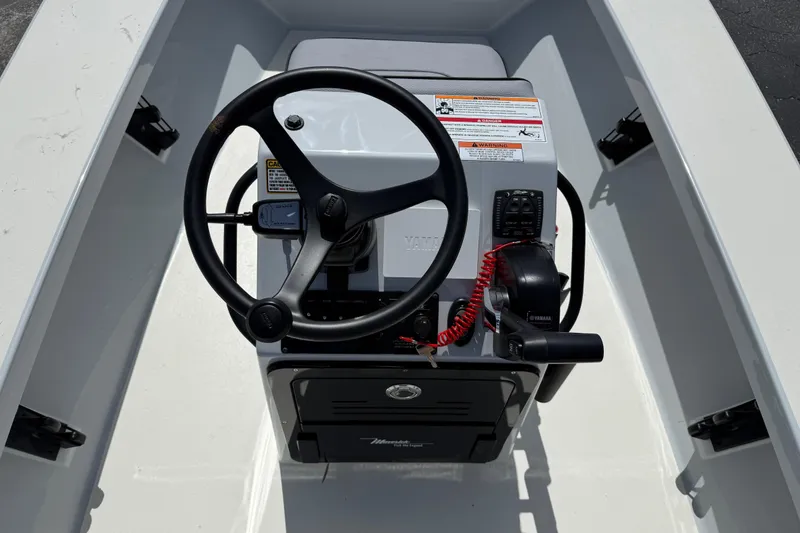 Slide: The Image of 2026 Maverick 17HPX-S boat console with steering wheel and controls. - 7