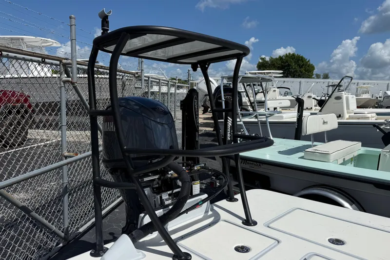 Slide: The Image of 2026 Maverick 17HPX-S boat with Yamaha engine, docked in a marina under a clear sky. - 8