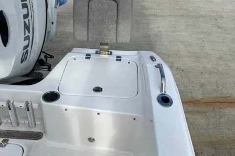 Slide: The Image of 2023 Sea Pro 199 Deep V Center Console boat with Suzuki engine, docked on concrete. - 10