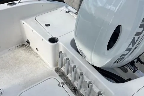 Slide: The Image of 2023 Sea Pro 199 Deep V Center Console boat with Suzuki outboard motor, rod holders, and storage. - 11