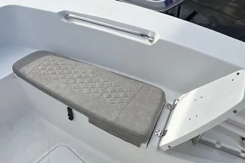 Slide: The Image of 2023 Sea Pro 199 Deep V Center Console boat seat with diamond-patterned cushion. - 13