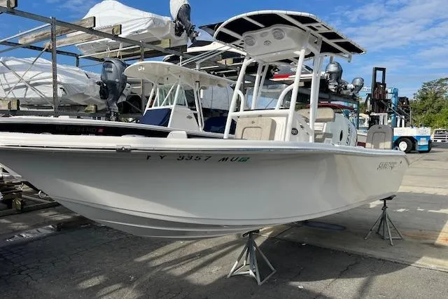 Slide: The Image of 2023 Sea Pro 199 Deep V Center Console boat on display in a marina. - 17