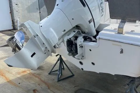 Slide: The Image of 2023 Sea Pro 199 Deep V Center Console boat engine on a stand. - 2