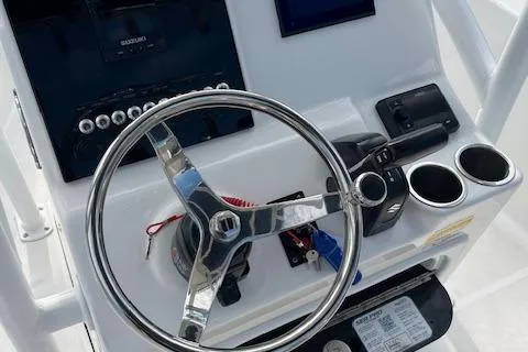Slide: The Image of 2023 Sea Pro 199 Deep V Center Console steering wheel and control panel. - 8