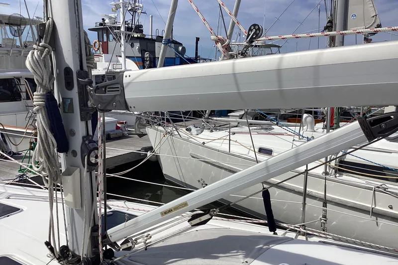 Slide: The Image of Sailboat rigging on a 2001 Hunter 380 yacht docked at a marina. - 12