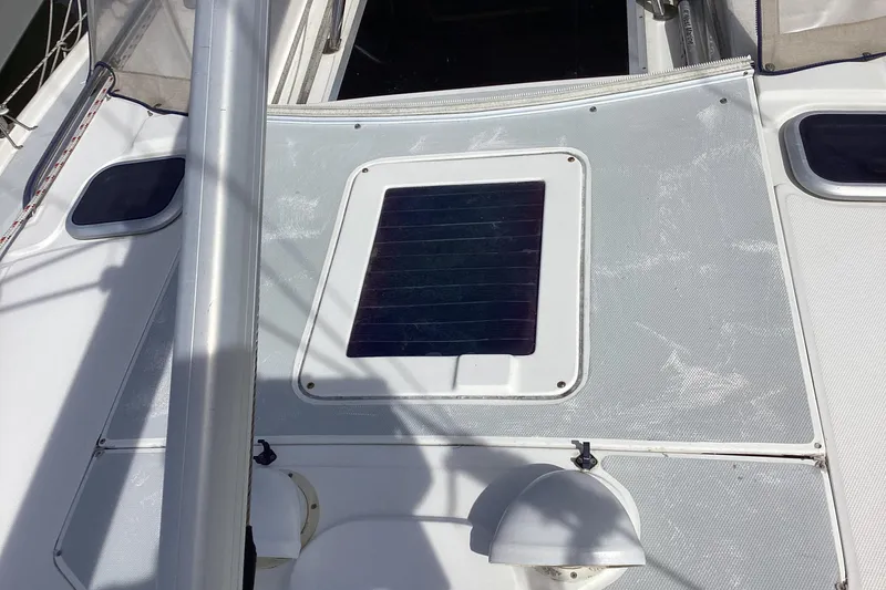 Slide: The Image of Deck of 2001 Hunter 380 sailboat with solar panel and hatch. - 15