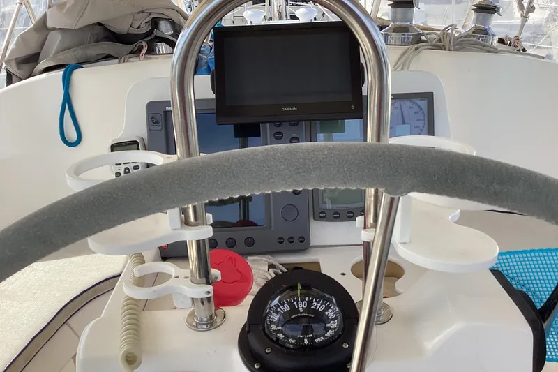 Slide: The Image of Cockpit of a 2001 Hunter 380 sailboat with navigation instruments and compass. - 18