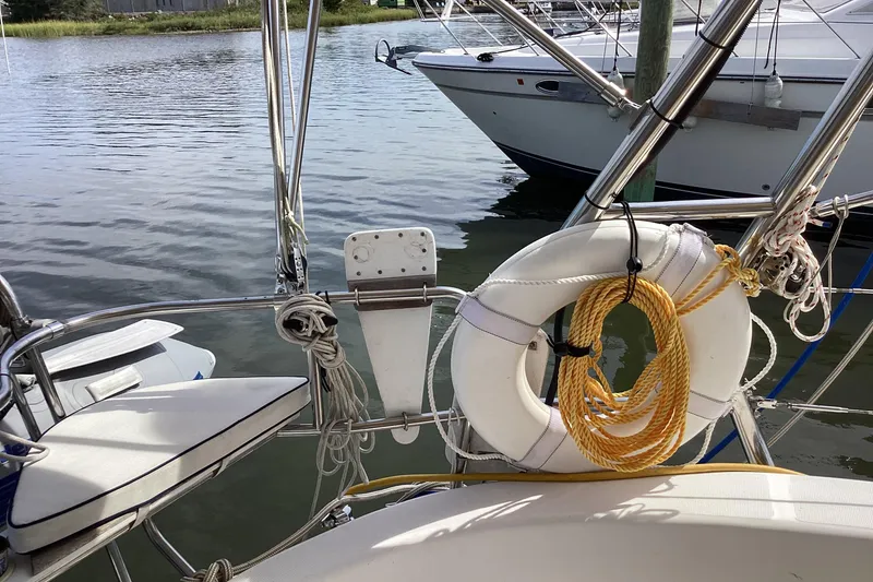 Slide: The Image of Sailboat deck with life preserver and ropes, Hunter 380, 2001 model. - 20