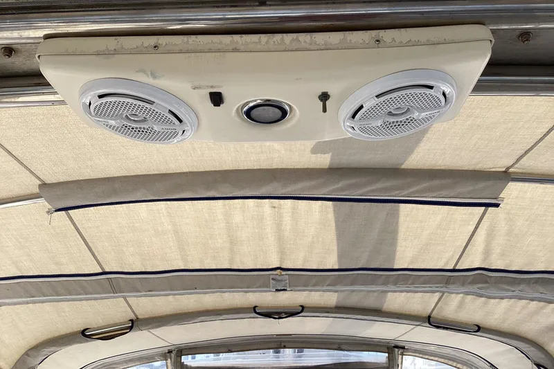 Slide: The Image of Ceiling speakers and light fixture on a 2001 Hunter 380 boat interior. - 21
