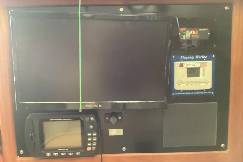 Slide: The Image of Control panel of a 2001 Hunter 380 yacht with navigation and marine systems. - 25