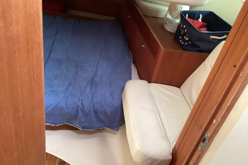 Slide: The Image of Interior cabin of 2001 Hunter 380 sailboat with bed and seating area. - 29