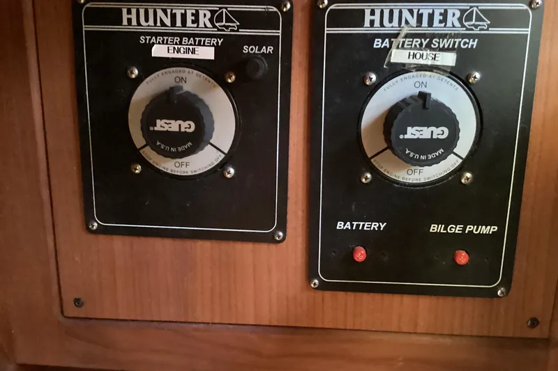 Slide: The Image of Control panel of a 2001 Hunter 380 sailboat with battery switches. - 35