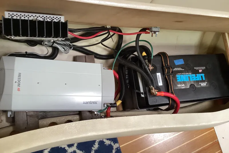 Slide: The Image of Electrical system of a 2001 Hunter 380 sailboat with Xantrex Freedom HF inverter and battery. - 54