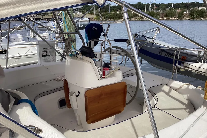 Slide: The Image of Cockpit of a 2001 Hunter 380 sailboat docked at a marina. - 8