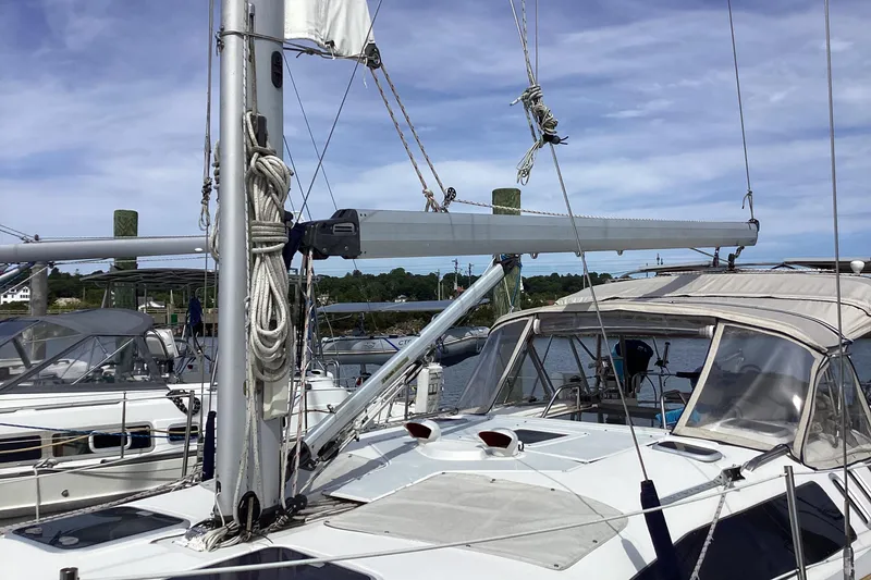 Slide: The Image of Sailboat Hunter 380, 2001 model, docked at marina under clear sky. - 9