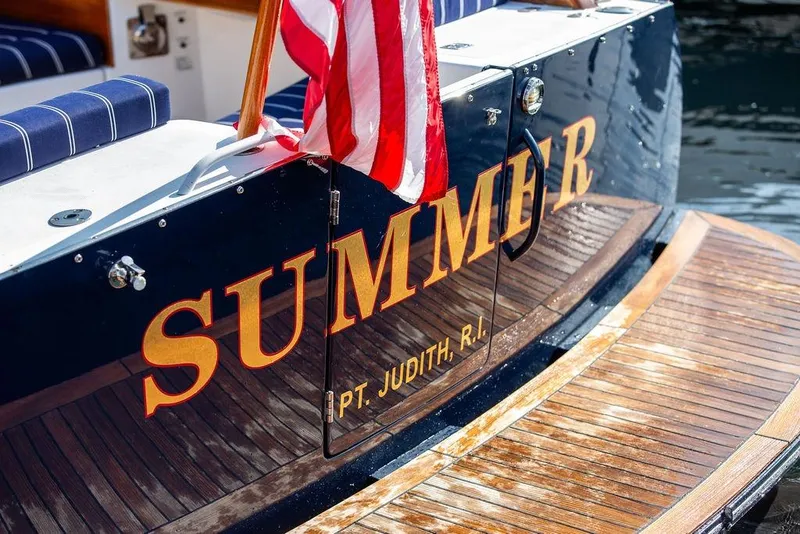 Slide: The Image of Hinckley Talaria 44 yacht, 2002, with American flag and "SUMMER" name, docked at Pt. Judith, R.I. - 11