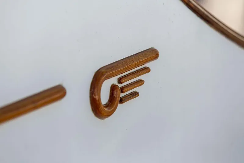 Slide: The Image of Close-up of a wooden emblem on a 2002 Hinckley Talaria 44 yacht. - 13