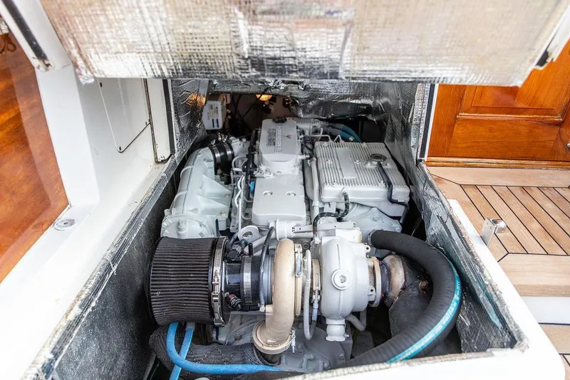 Slide: The Image of Engine compartment of a 2002 Hinckley Talaria 44 yacht, showcasing detailed mechanical components. - 35