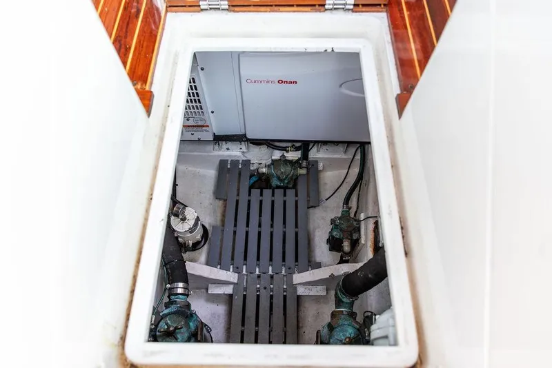 Slide: The Image of Engine compartment of 2002 Hinckley Talaria 44 with Cummins Onan generator visible. - 36