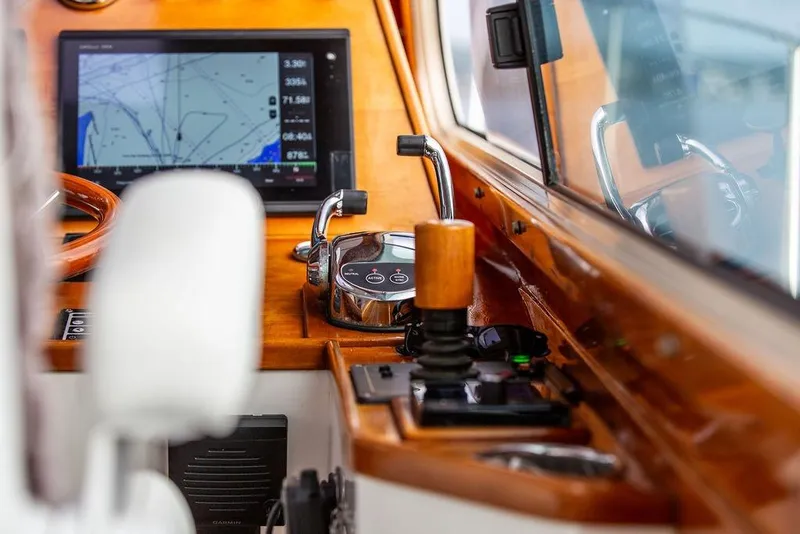 Slide: The Image of Hinckley Talaria 44 yacht cockpit with navigation screen and controls, 2002 model. - 24