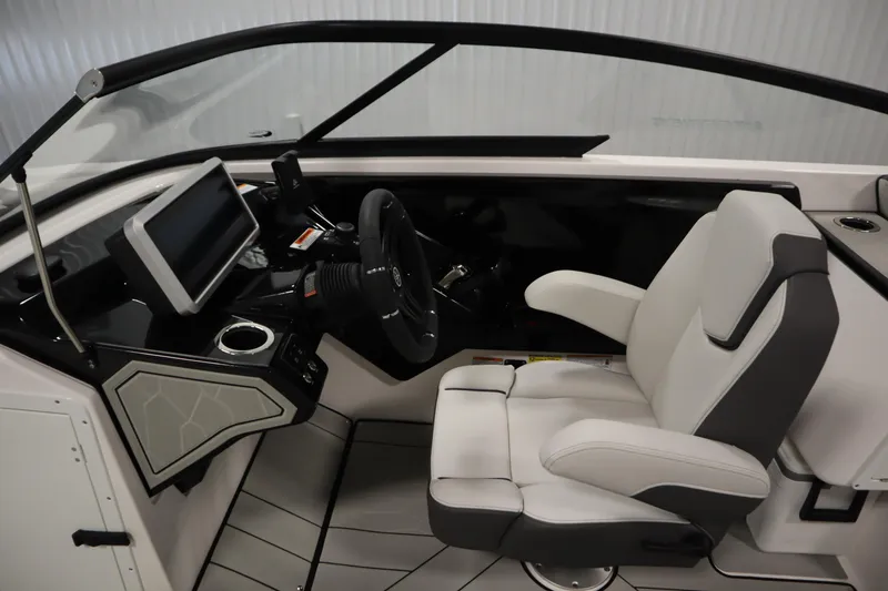 Slide: The Image of 2025 Yamaha Boats 252XE cockpit with modern steering and comfortable seating. - 17