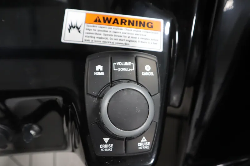 Slide: The Image of Yamaha Boats 252XE 2025 control panel with warning label and navigation buttons. - 22