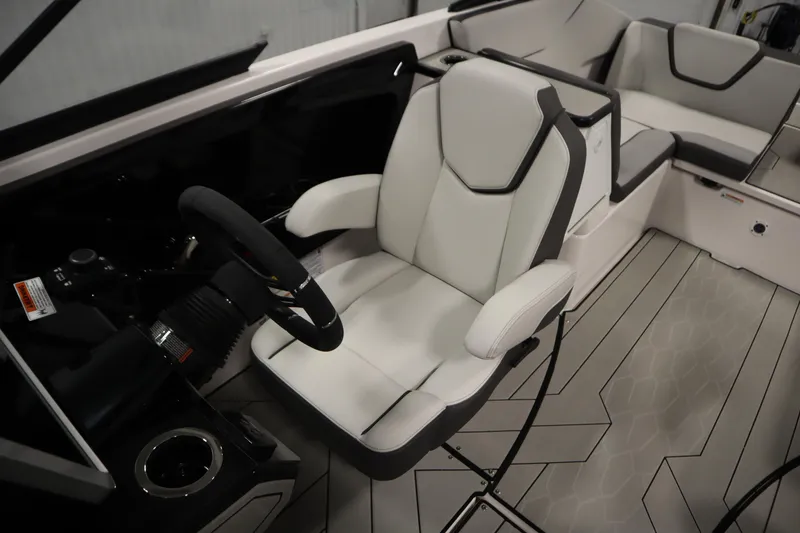 Slide: The Image of 2025 Yamaha Boats 252XE interior with modern seating and steering wheel. - 24