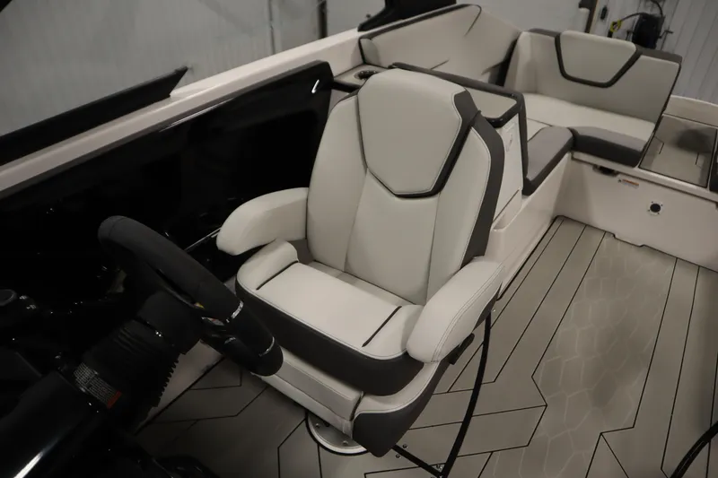 Slide: The Image of 2025 Yamaha Boats 252XE interior with modern seating and steering wheel. - 25