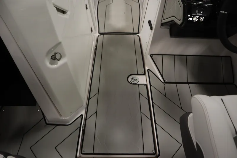 Slide: The Image of 2025 Yamaha Boats 252XE interior with sleek, modern flooring and stylish design elements. - 26