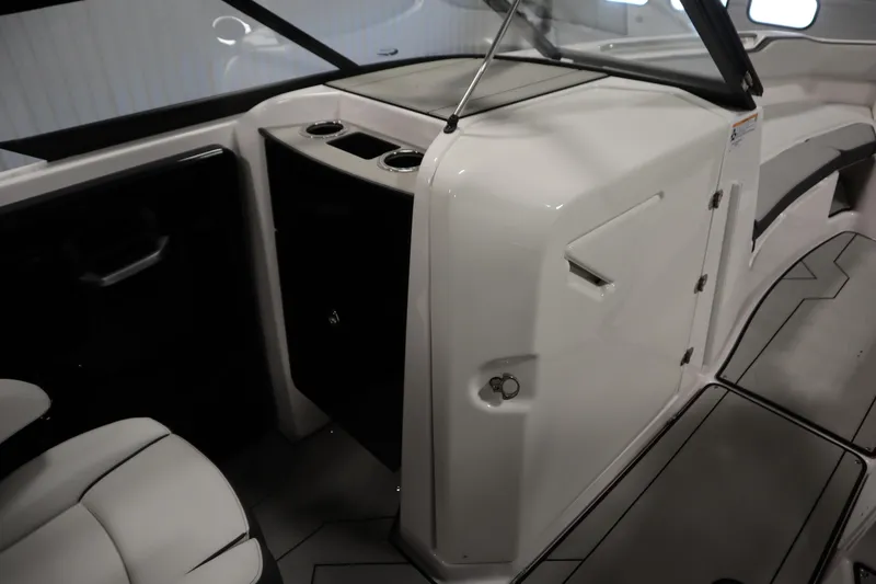 Slide: The Image of 2025 Yamaha Boats 252XE interior, featuring sleek design and modern seating arrangement. - 27