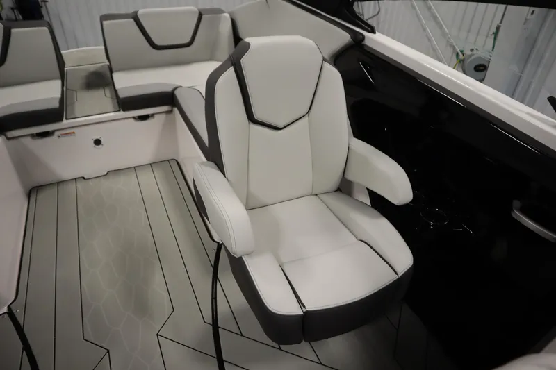 Slide: The Image of 2025 Yamaha Boats 252XE interior with sleek, modern seating and stylish design. - 29