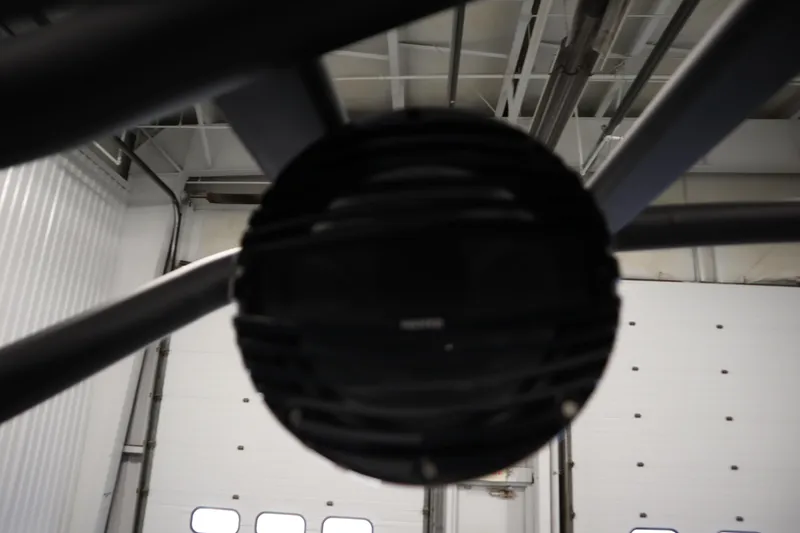 Slide: The Image of Close-up of Yamaha Boats 252XE 2025 speaker system in a garage setting. - 37