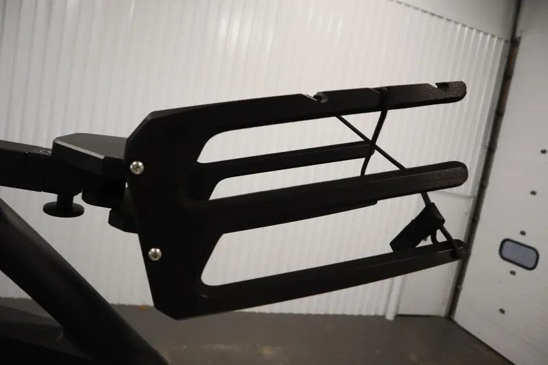 Slide: The Image of 2025 Yamaha Boats 252XE wakeboard rack in a garage setting. - 39