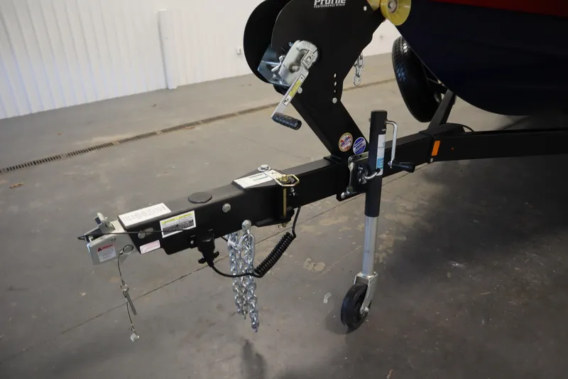 Slide: The Image of Trailer hitch of 2025 Yamaha Boats 252XE in a garage setting. - 44