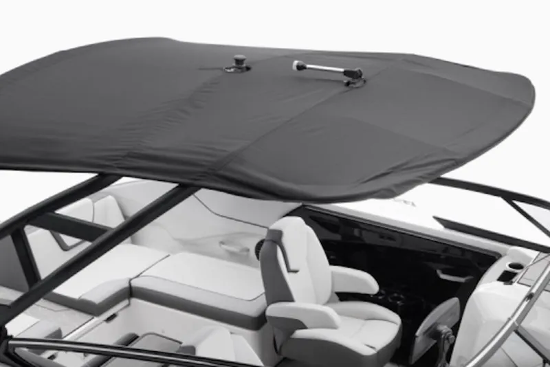 Slide: The Image of 2025 Yamaha Boats 252XE interior with canopy, featuring sleek seating and modern design. - 52